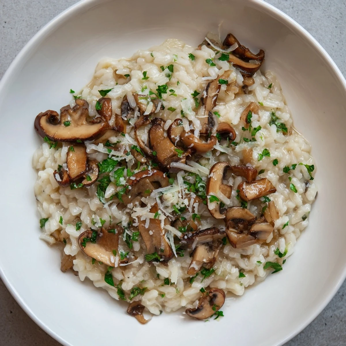 Tempting Stove-Top Creamy Risotto, fragrant with garlic and butter, is a comforting vegetarian main course.