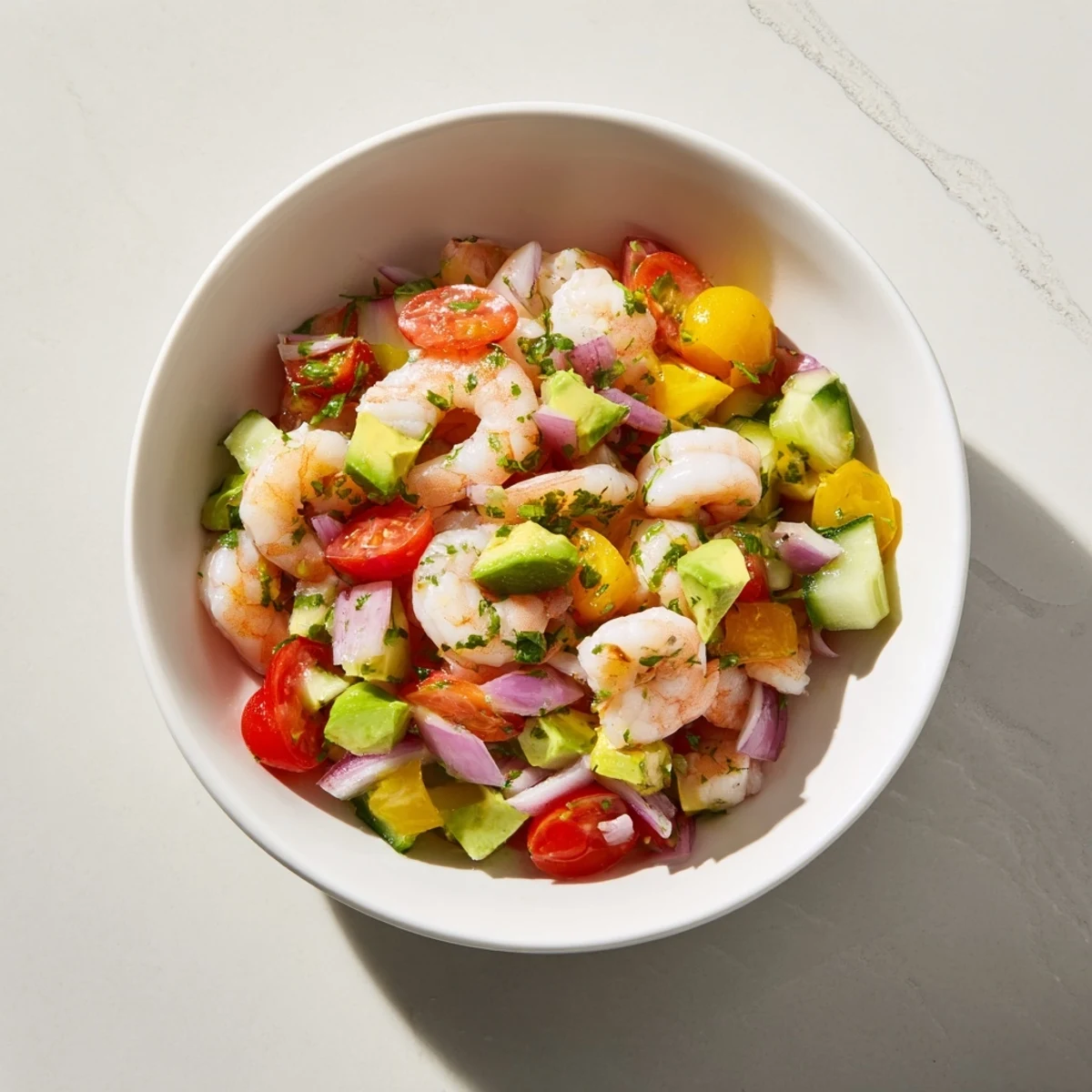 Vibrant light & fresh shrimp ceviche, ready to eat, featuring a colorful mix of shrimp, citrus, and vegetables.