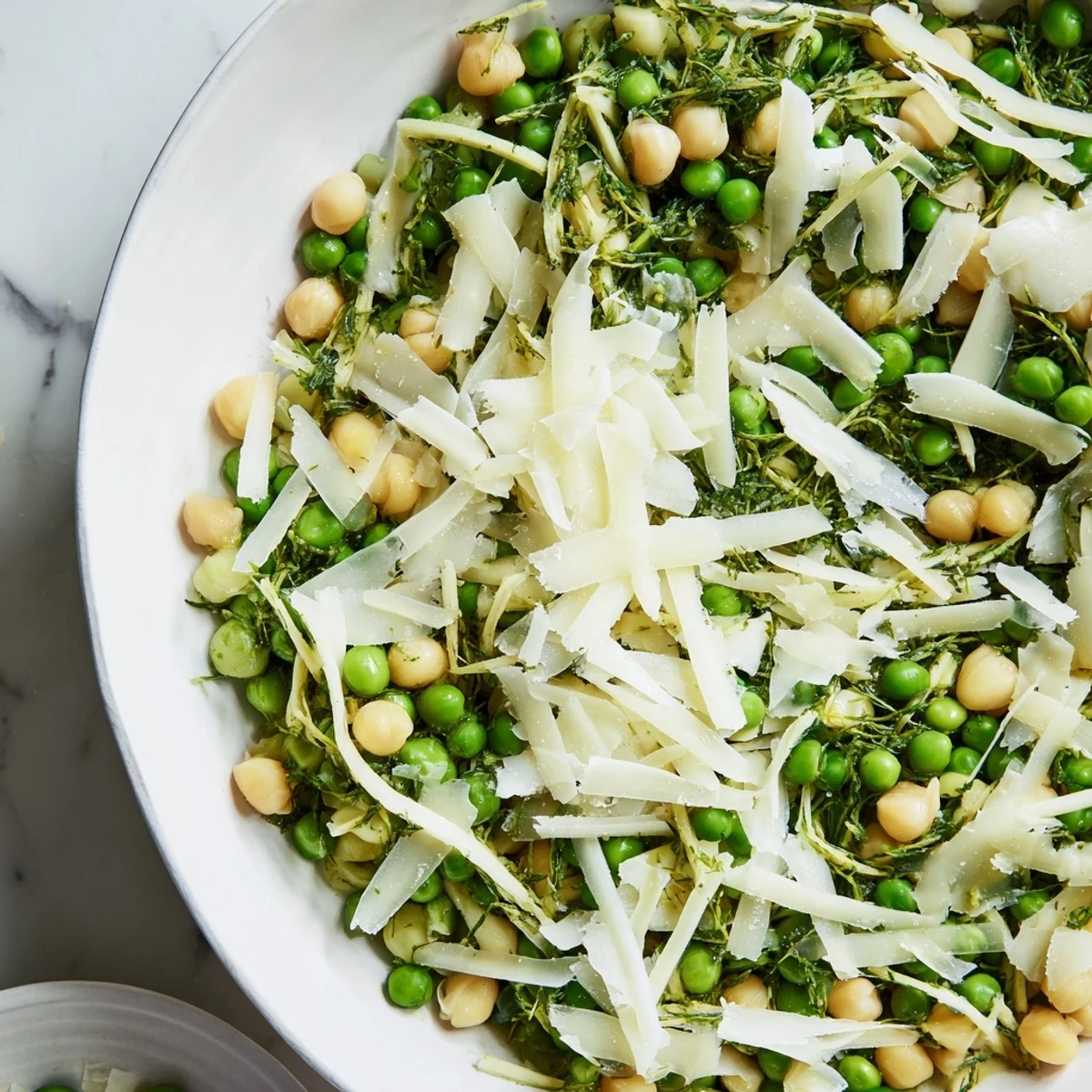 The English Ivy Salad on a platter, featuring vibrant green beans and snap peas with cheddar.