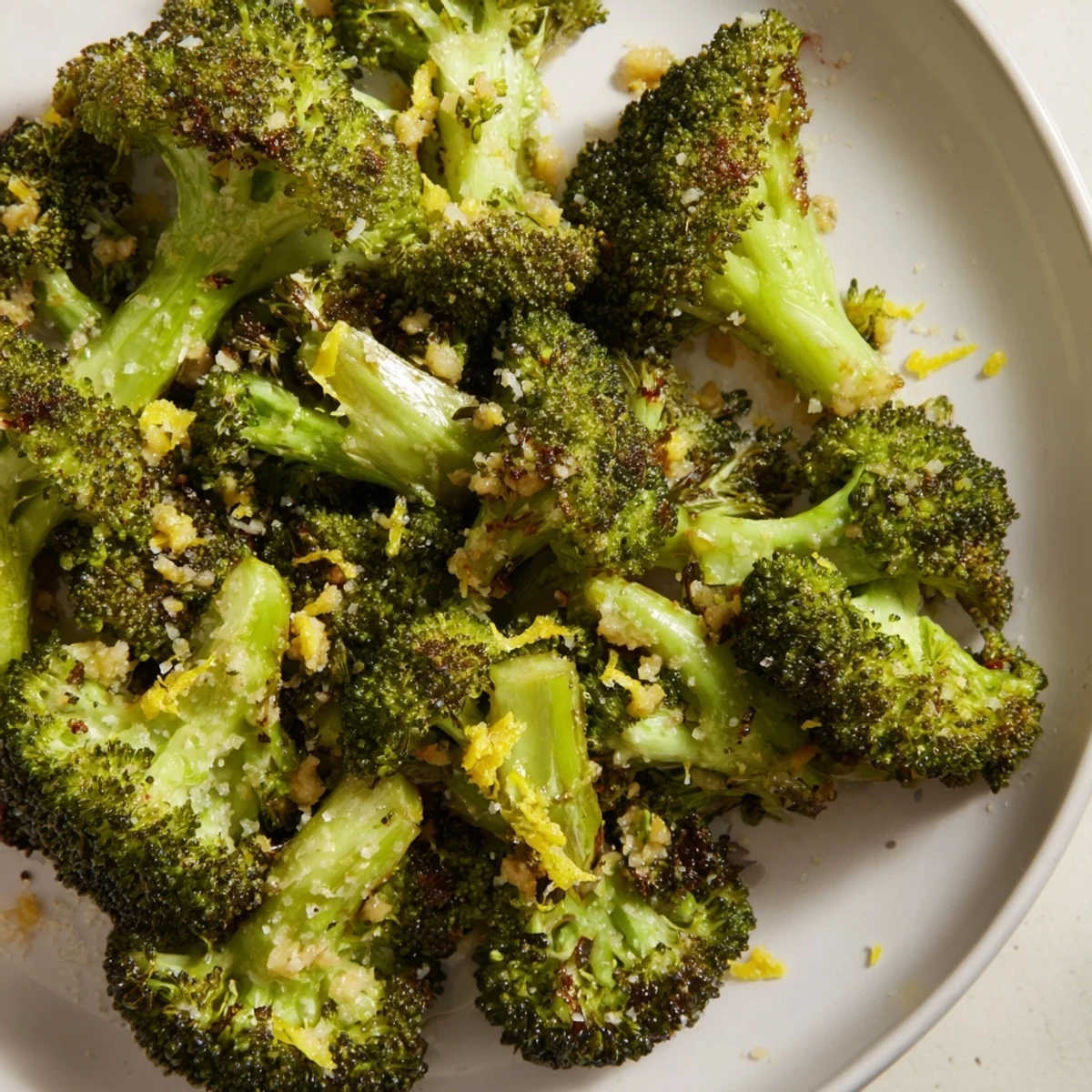 Golden, crispy Lemon Garlic Roasted Broccoli piled high, offering a bright, savory side.
