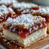 Earl Grey Tea, Guava, and Lemon Bars showcase a golden crust with a vibrant guava swirl and tart lemon filling.
