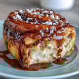 Easy overnight orange rolls baked golden, topped with a tangy citrus glaze.  