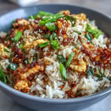Savory egg fried rice with spicy chili crisp, ready to serve hot.