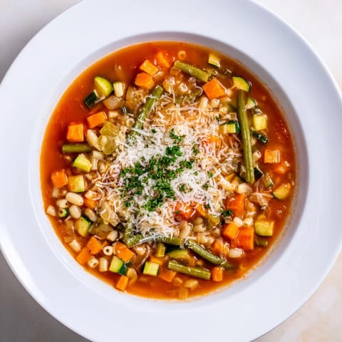 Close-up of hearty Simple One-Pot Minestrone Soup with vibrant vegetables and tender pasta.