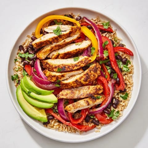 Make-Ahead Chicken Fajita Meal Prep Bowls showcasing colorful peppers, tender chicken, and fresh cilantro, a delicious meal.