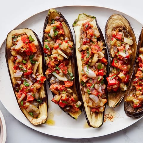 Sizzling Imam Bayildi, a vegetarian Turkish delight, presents beautifully soft eggplant ready to enjoy.