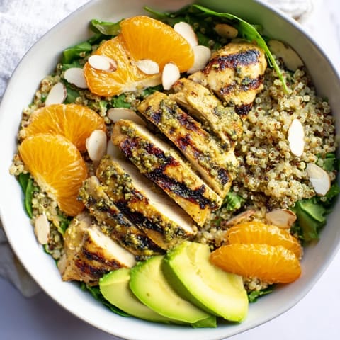 Fresh citrus vinaigrette glistens on this vibrant Citrus Herb Chicken Salad Bowl, garnished with toasted almonds.