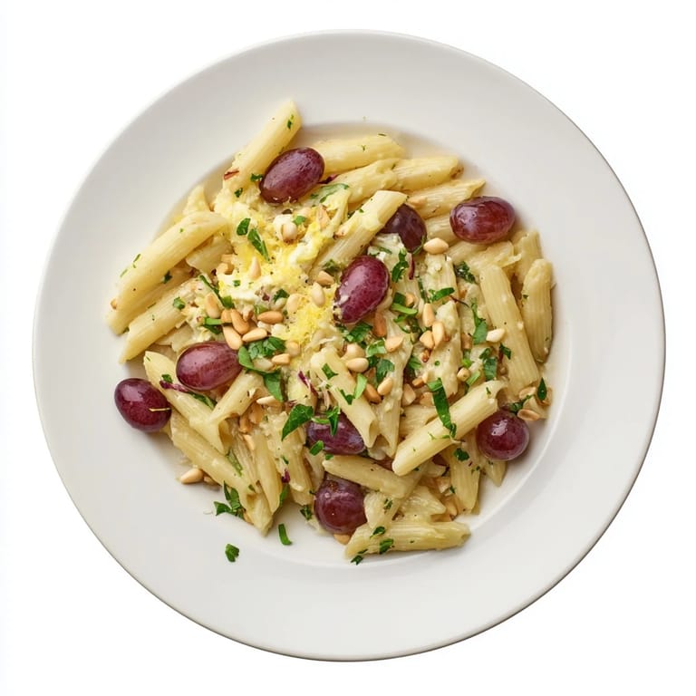 This flavorful Pasta with Roasted Grapes showcases dark, caramelized grapes tossed with ricotta cheese.