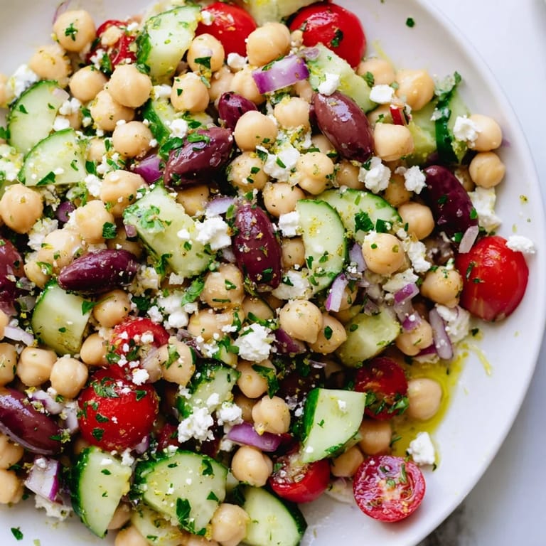 Imagine a refreshing bowl of Mediterranean Chickpea Salad, a vegetarian delight with a zesty lemon dressing.