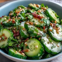 Crispy Asian cucumber salad with sesame and rice vinegar dressing, a light and tangy vegan side dish.