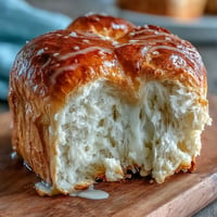 Golden Japanese Milk Bread loaf, incredibly fluffy and ready for butter.